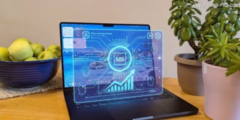 Laptop displaying a blue-themed interface with data visualizations and charts.