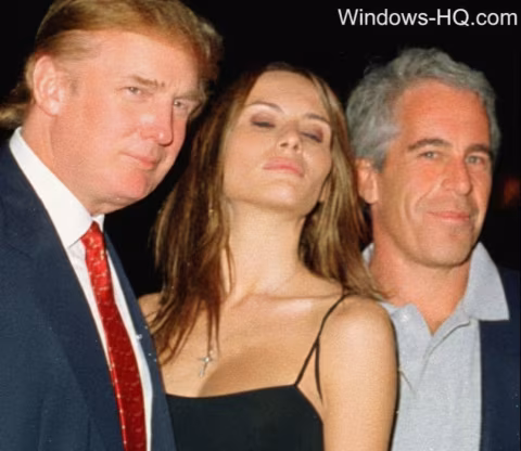Three people pose for a photo: a man in a suit, a woman, and a man in a light shirt.