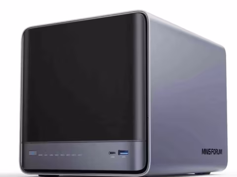 Small rectangular mini PC housed in a silver and black casing.