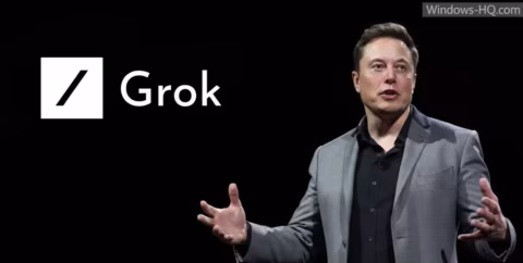 Elon Musk stands next to a logo displaying the text 'Grok'.
