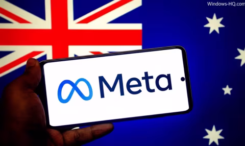 A person holding a smartphone displaying the Meta logo against the background of the Australian flag.