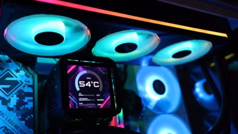 A PC component featuring visible liquid CPU cooling tubes, fan headers, and digital temperature display.