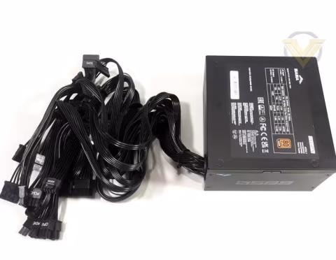 Power supply unit and multiple cables laid out on a white surface.