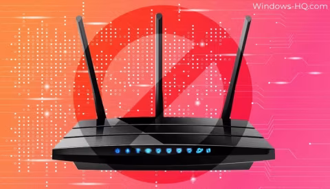 A black wireless router with three antennas against an orange and red background.