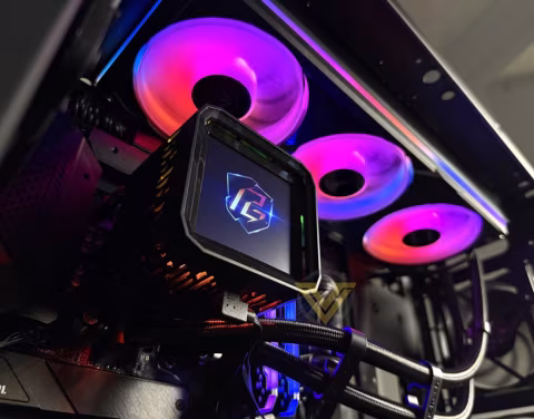 A modern computer case displaying a visible LCD screen and several illuminated fans.