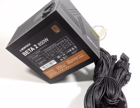 A black Montech Beta 2 850W power supply unit connected to multiple black cables.
