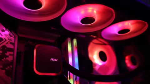 Close-up view of a black computer case with visible fans and an MSI logo.