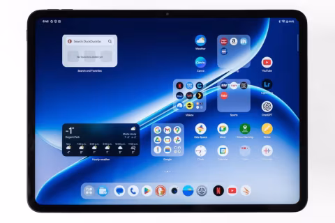 A digital tablet displaying a home screen interface with various apps and widgets.