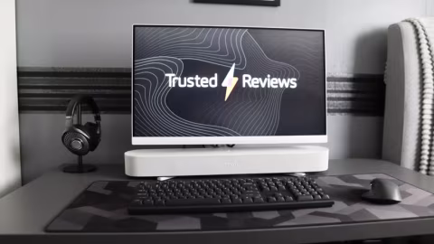 A desktop setup featuring a computer monitor, keyboard, and mouse.