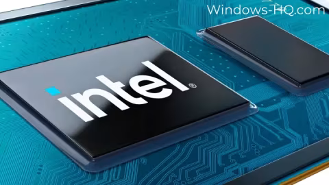 A close-up shot of a central processing unit (CPU) chip featuring the Intel logo, placed on a printed circuit board.
