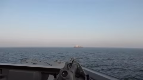 Horizon view featuring the ocean, a distant vessel, and an overwater perspective from a ship.