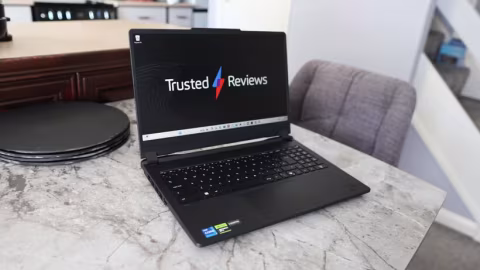 Open laptop displaying a website with the 'Trusted Reviews' logo and black screen.