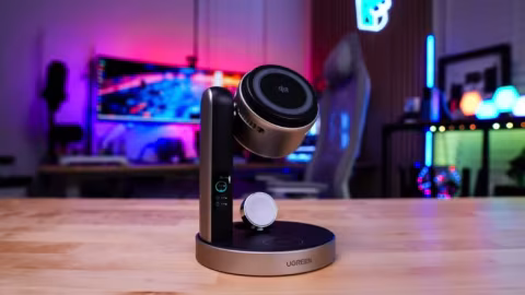 UGREEN charging station setup featuring a wireless charging puck and a vertical charging block on a wooden surface.