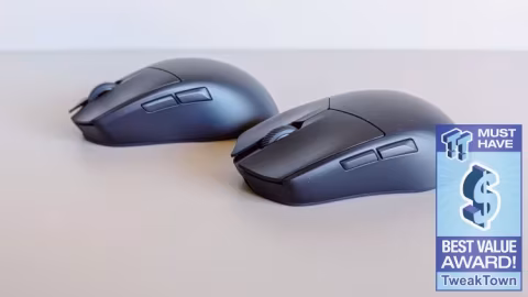 Two black computer mice, one ergonomic and one compact, displayed on a light surface.