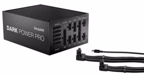 Black rectangular power supply unit labeled "DARK POWER PRO" and "be quiet!", shown connected to black cables.