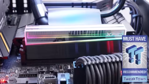 Close-up view of illuminated RAM modules with XPG branding installed onto a motherboard.