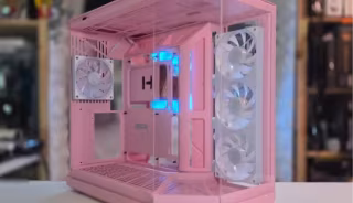 Pink, cube-shaped computer case open to display internal components and cooling fans.