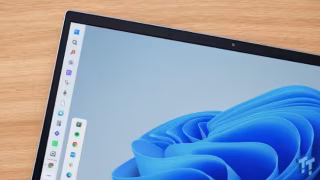 A digital screen displaying an operating system interface with a sidebar and abstract blue layered graphic.