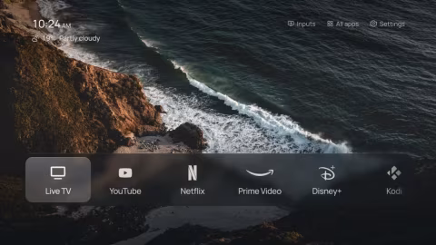 Screenshot of a media launcher interface showing a coastal scene background, time, weather, and app icons including Netflix and Disney+.