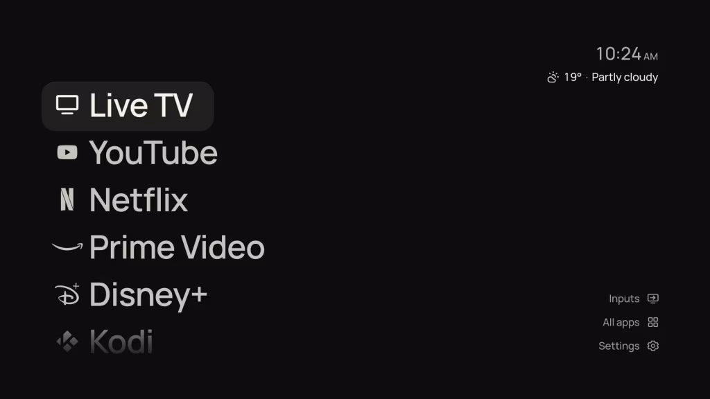FoyerLauncher's List layout on a dark background, with Live TV, YouTube, Netflix, Prime Video, Disney+ and Kodi down the left, the time and weather at the top right, and Inputs, All apps and Settings at the bottom right